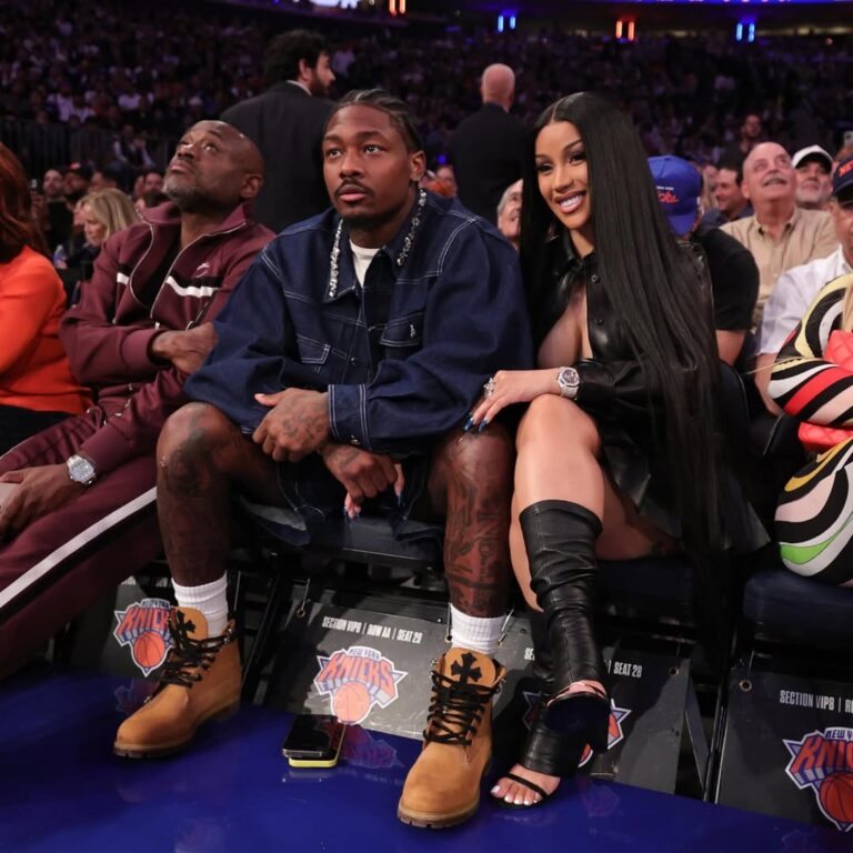 New Fashion Bomb Couple Cardi B and Stefon Diggs Sit Courtside with Cardi in a Leather Miu Miu Shirt